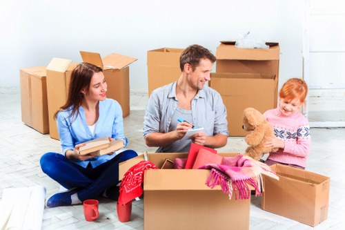 Moving day preparation with labelled boxes and protected furniture