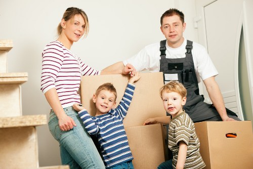 Removal team handling furniture carefully in a Brompton property