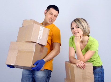 Removal van and moving team preparing a home move in Brompton