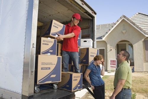 Business relocation crew moving office furniture carefully