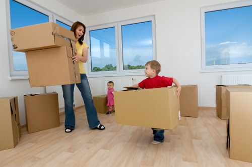 Packed boxes and household items being loaded into a removals van